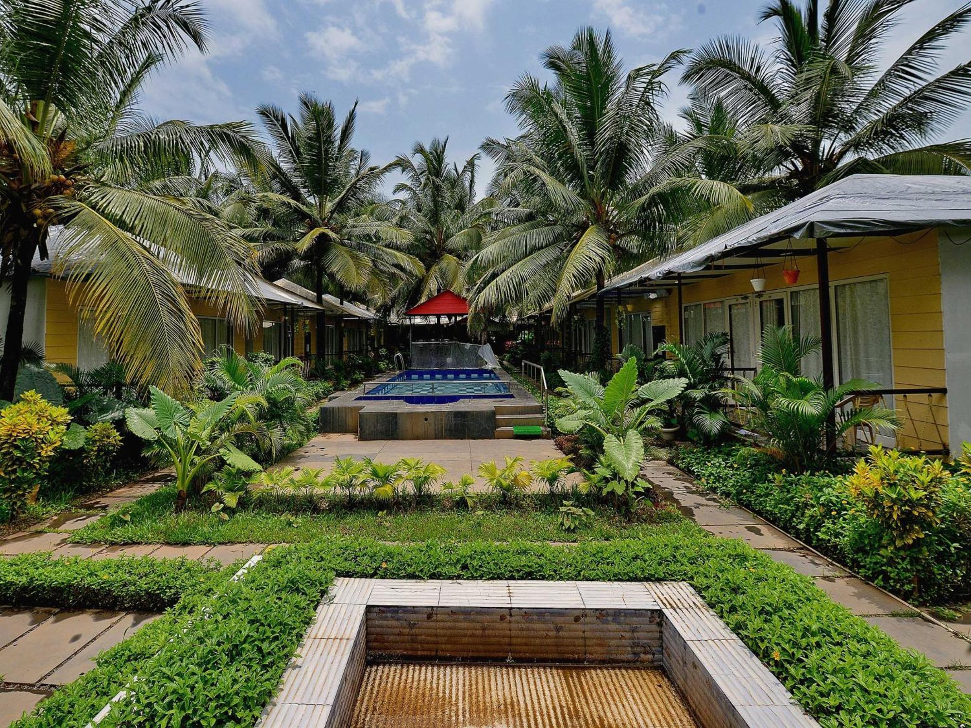 Collection O Retreat Morjim Resort Extérieur photo
